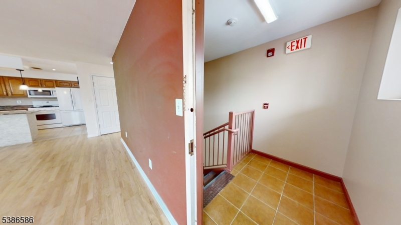 534 Maple Avenue Elizabeth, NJ 07202 - Photo 9 of 48 a view of a hallway with wooden floor