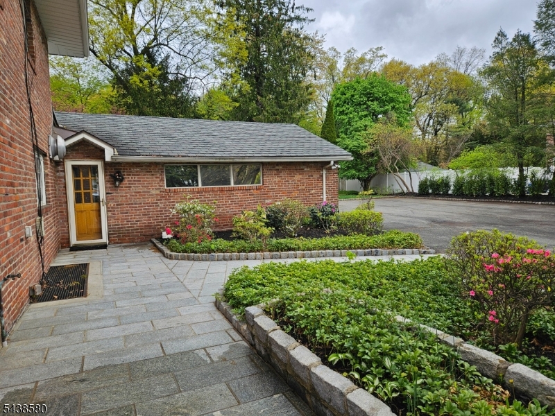 218 Devon Road Essex Fells, NJ 07021 - Photo 7 of 24 a front view of a house with garden