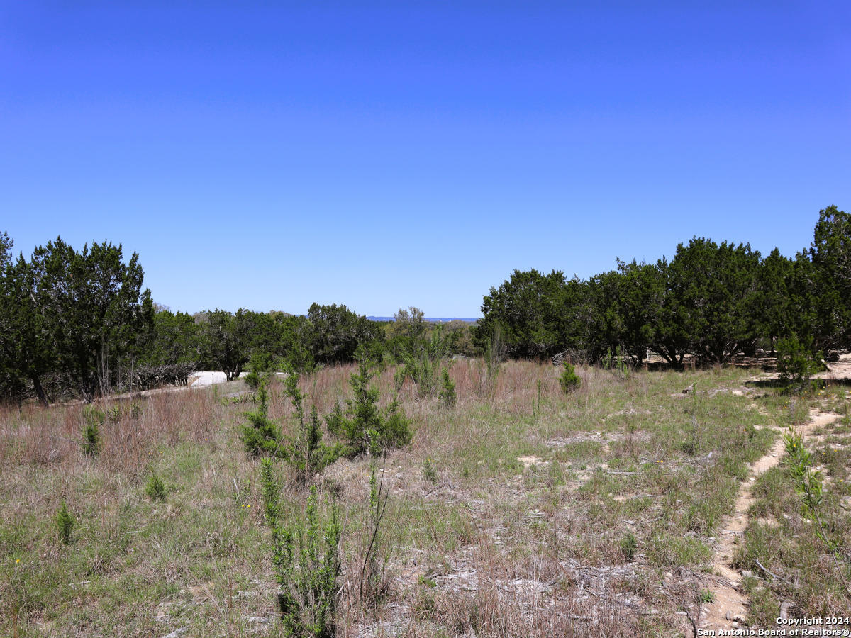 Lot 767 Hager Ridge Bandera, TX 78003 - Photo 13 of 32 a view of lake with mountain in background