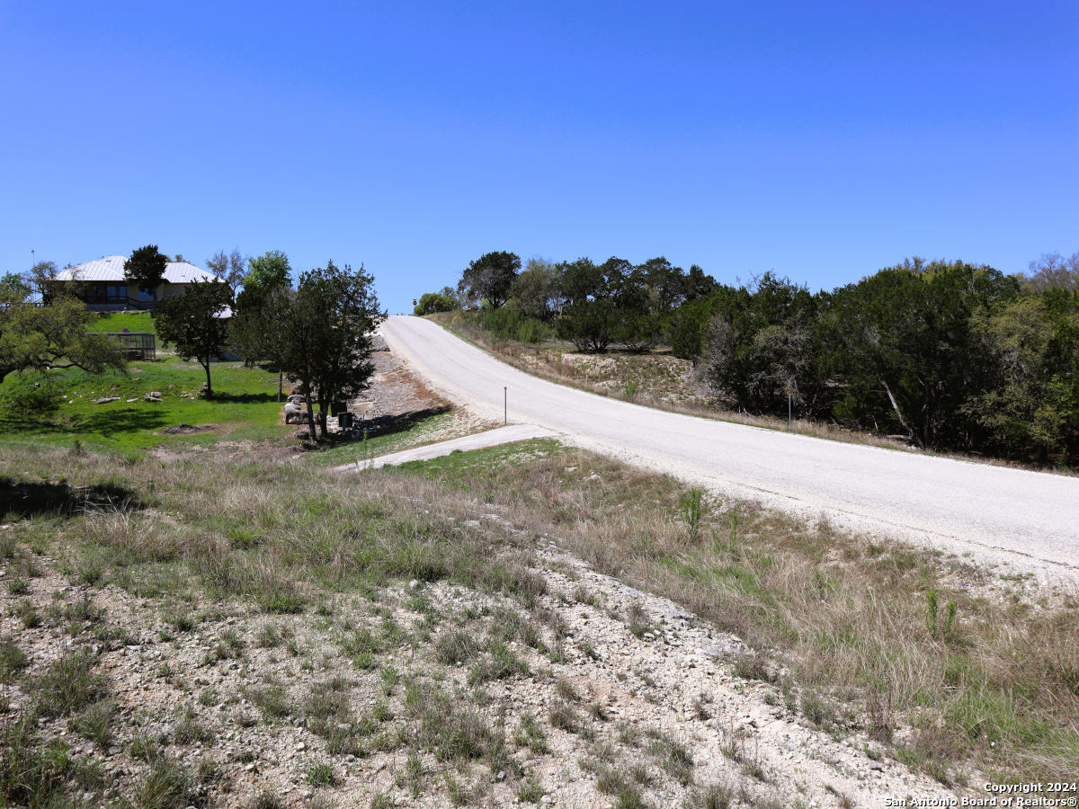 Lot 767 Hager Ridge Bandera, TX 78003 - Photo 17 of 32 a view of a dry yard with trees