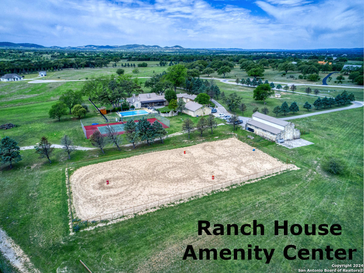 Lot 767 Hager Ridge Bandera, TX 78003 - Photo 21 of 32 a view of a road with a garden in the background