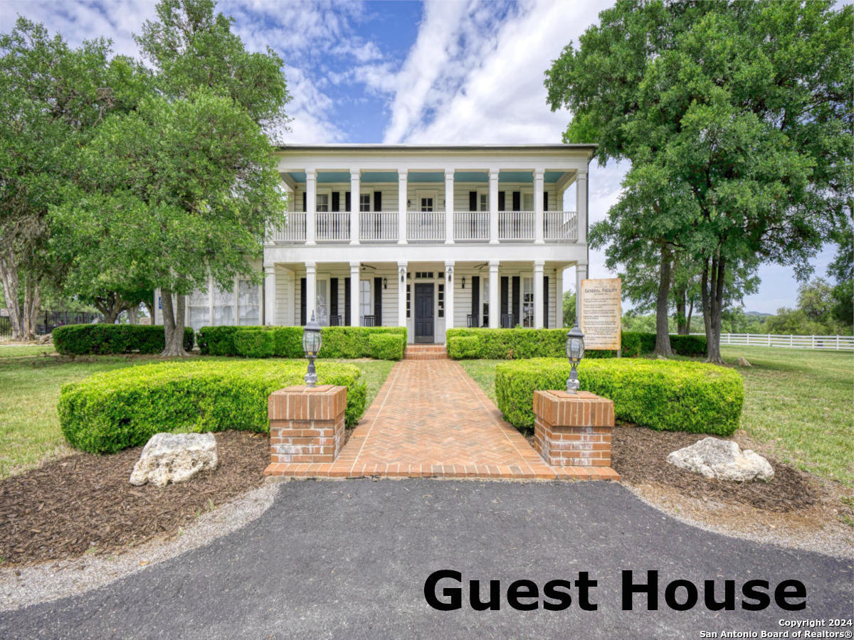 Lot 767 Hager Ridge Bandera, TX 78003 - Photo 31 of 32 front view of a house with a yard