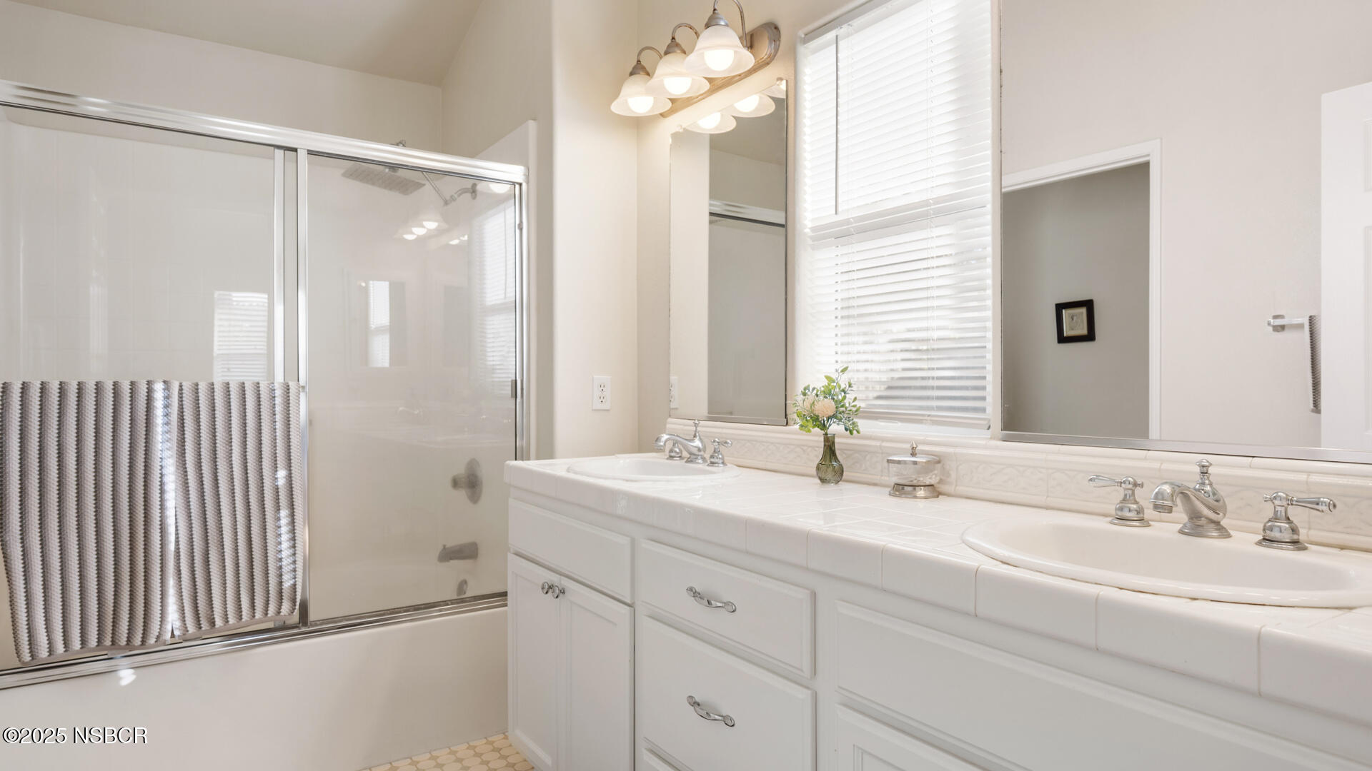 738 Hill Street Los Alamos, CA 93440 - Photo 12 of 27 a bathroom with a double vanity sink mirror and double