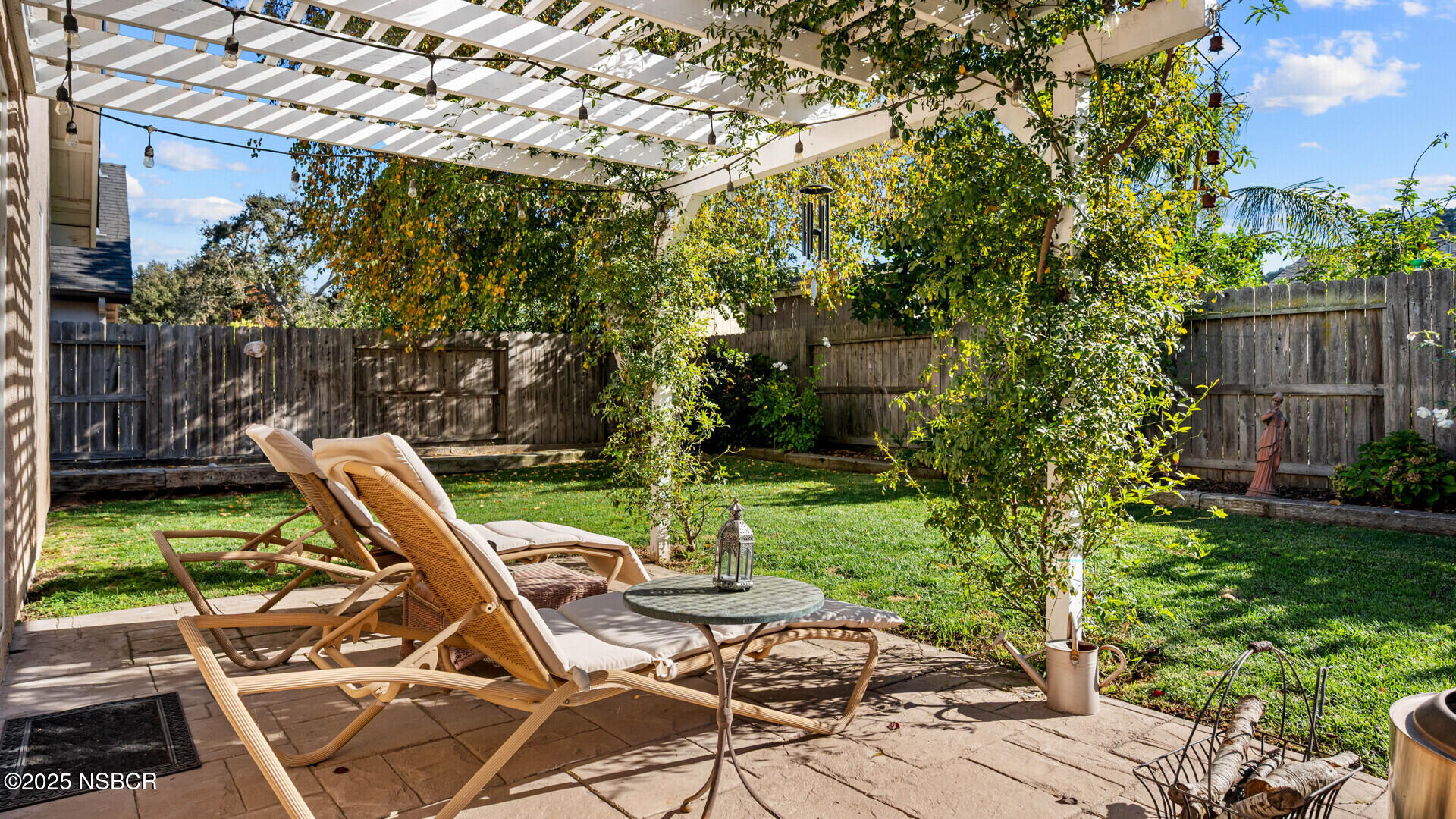 738 Hill Street Los Alamos, CA 93440 - Photo 19 of 27 a view of backyard with a table and chairs