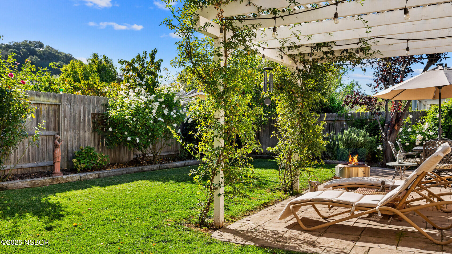 738 Hill Street Los Alamos, CA 93440 - Photo 20 of 27 a view of a chair and tables in the garden