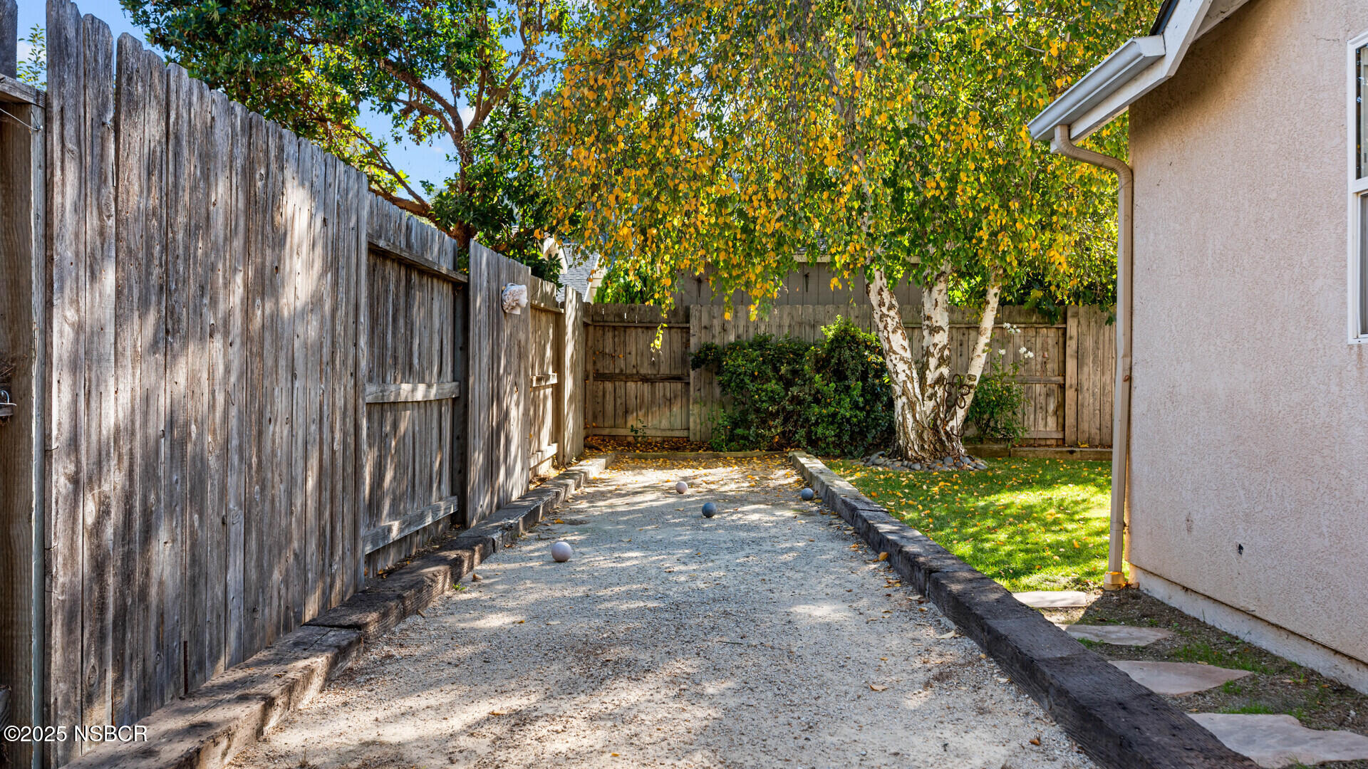 738 Hill Street Los Alamos, CA 93440 - Photo 23 of 27 a view of a pathway of a yard with wooden fence
