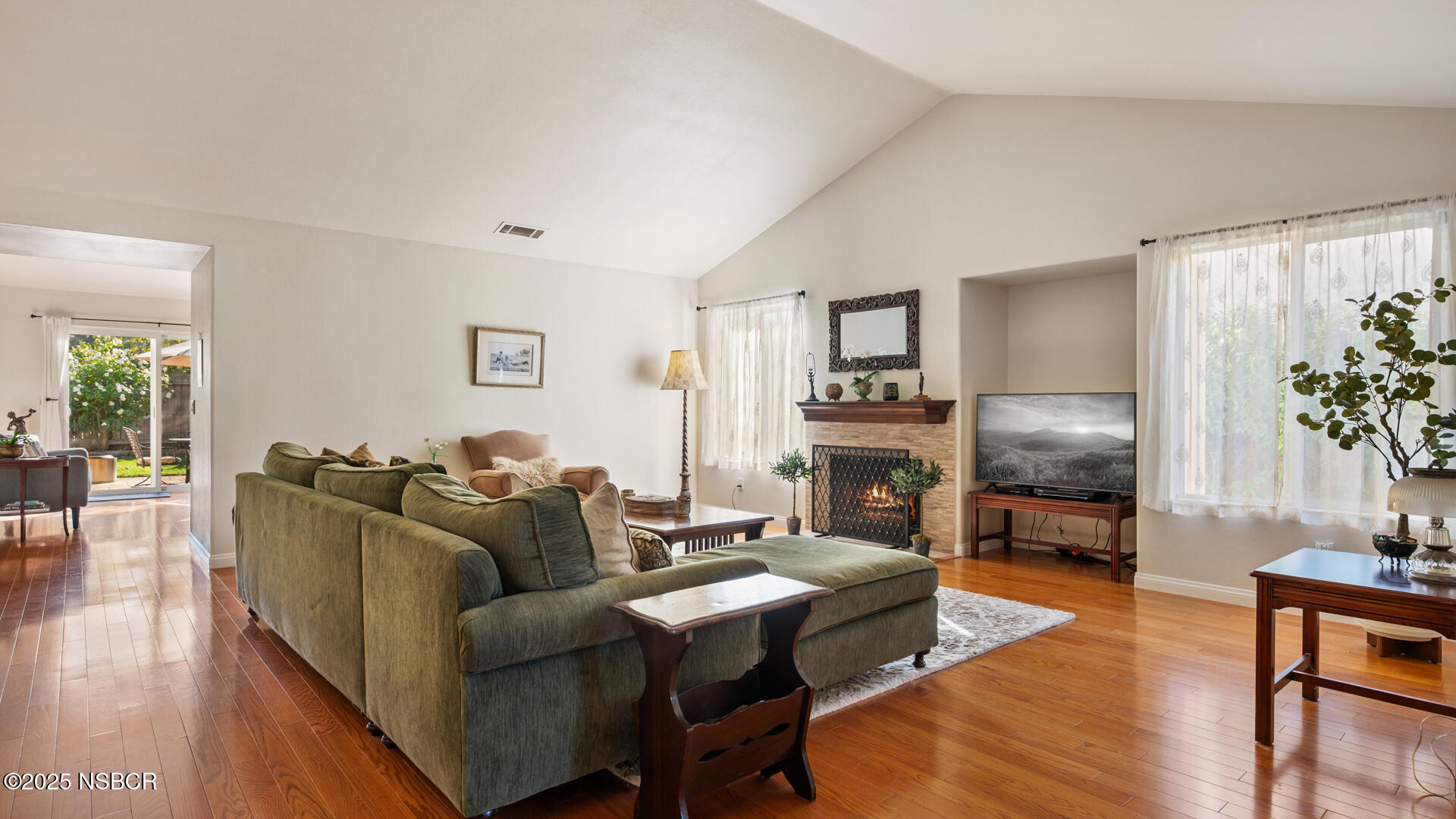 738 Hill Street Los Alamos, CA 93440 - Photo 5 of 27 a living room with fireplace furniture and a flat screen tv