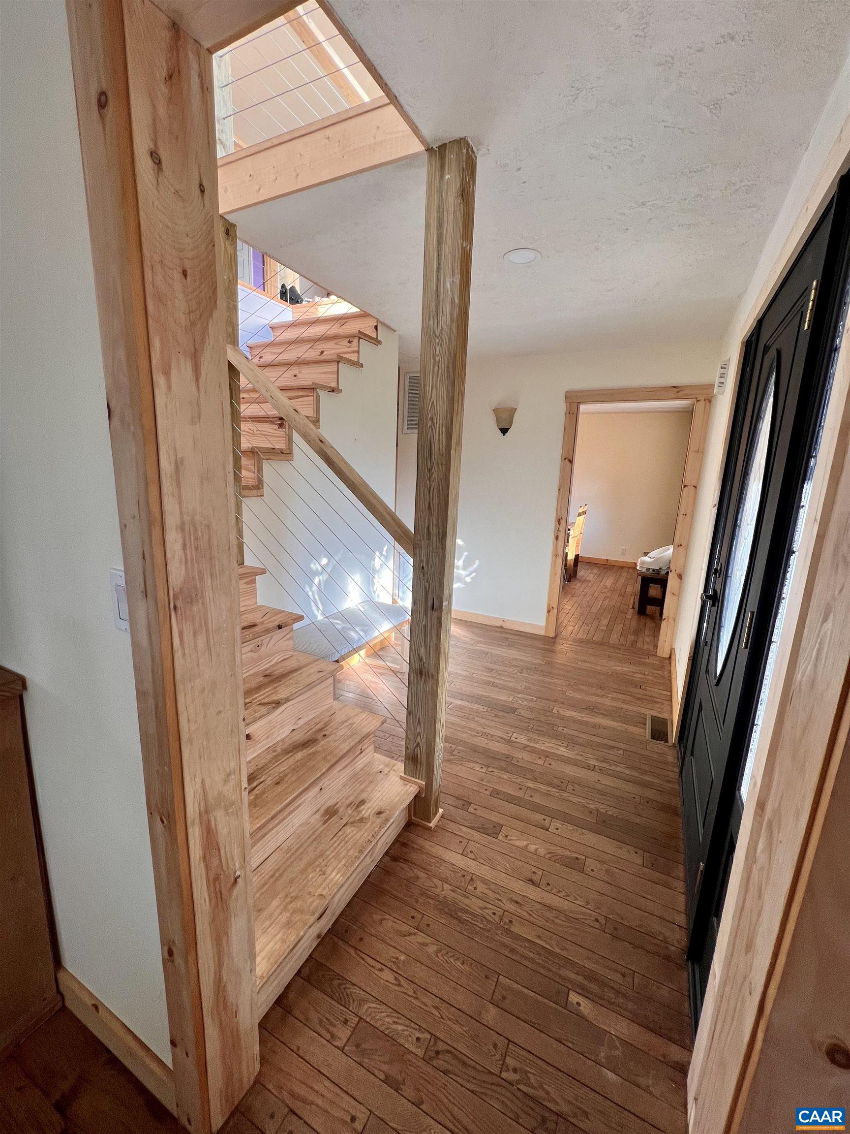 8876 East Timber Ridge Road Mount Crawford, VA 22841 - Photo 13 of 75 a view of a hallway with wooden floor and stairs