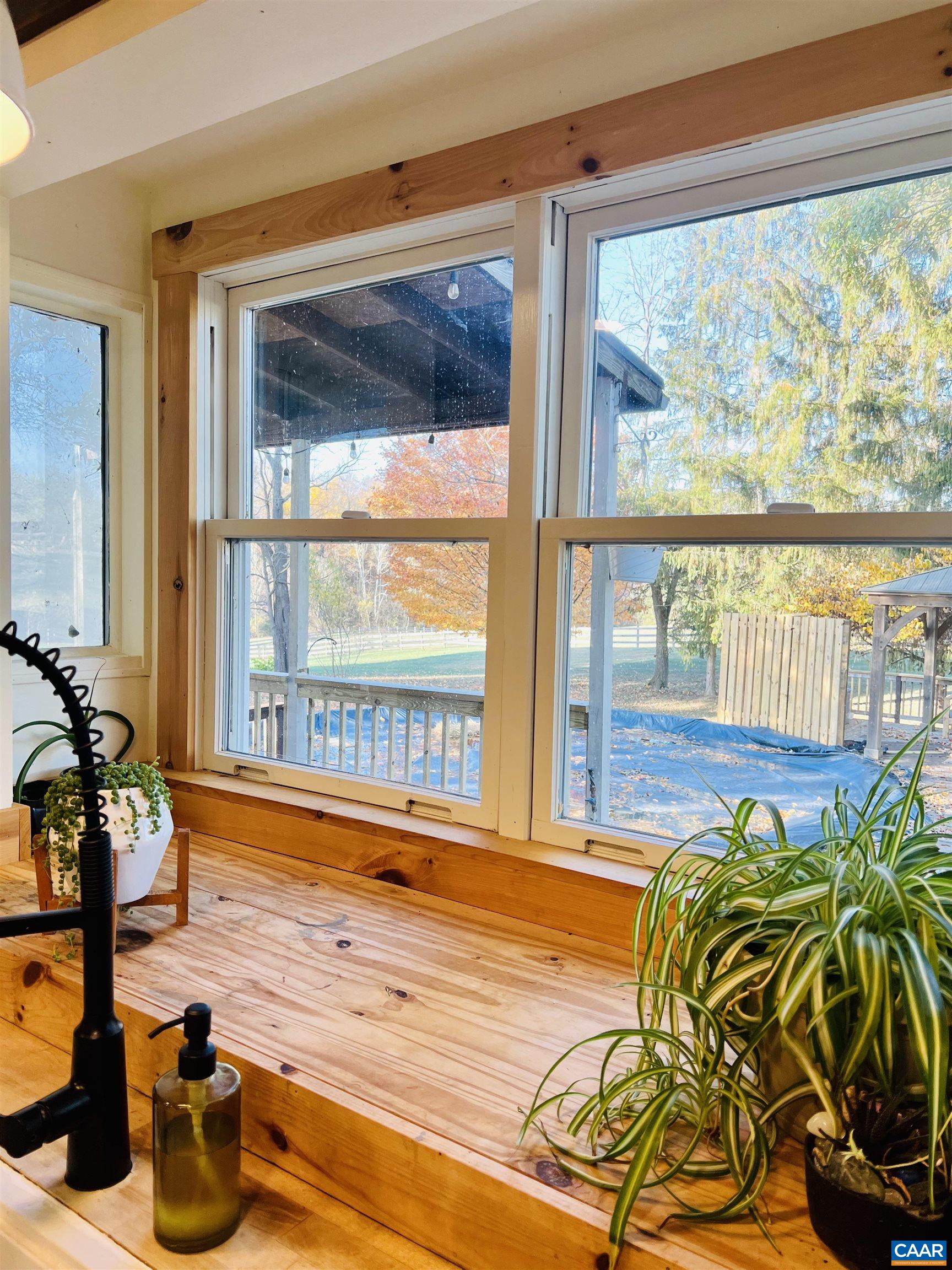 8876 East Timber Ridge Road Mount Crawford, VA 22841 - Photo 17 of 75 a view of a living room and floor to ceiling window or wooden floor