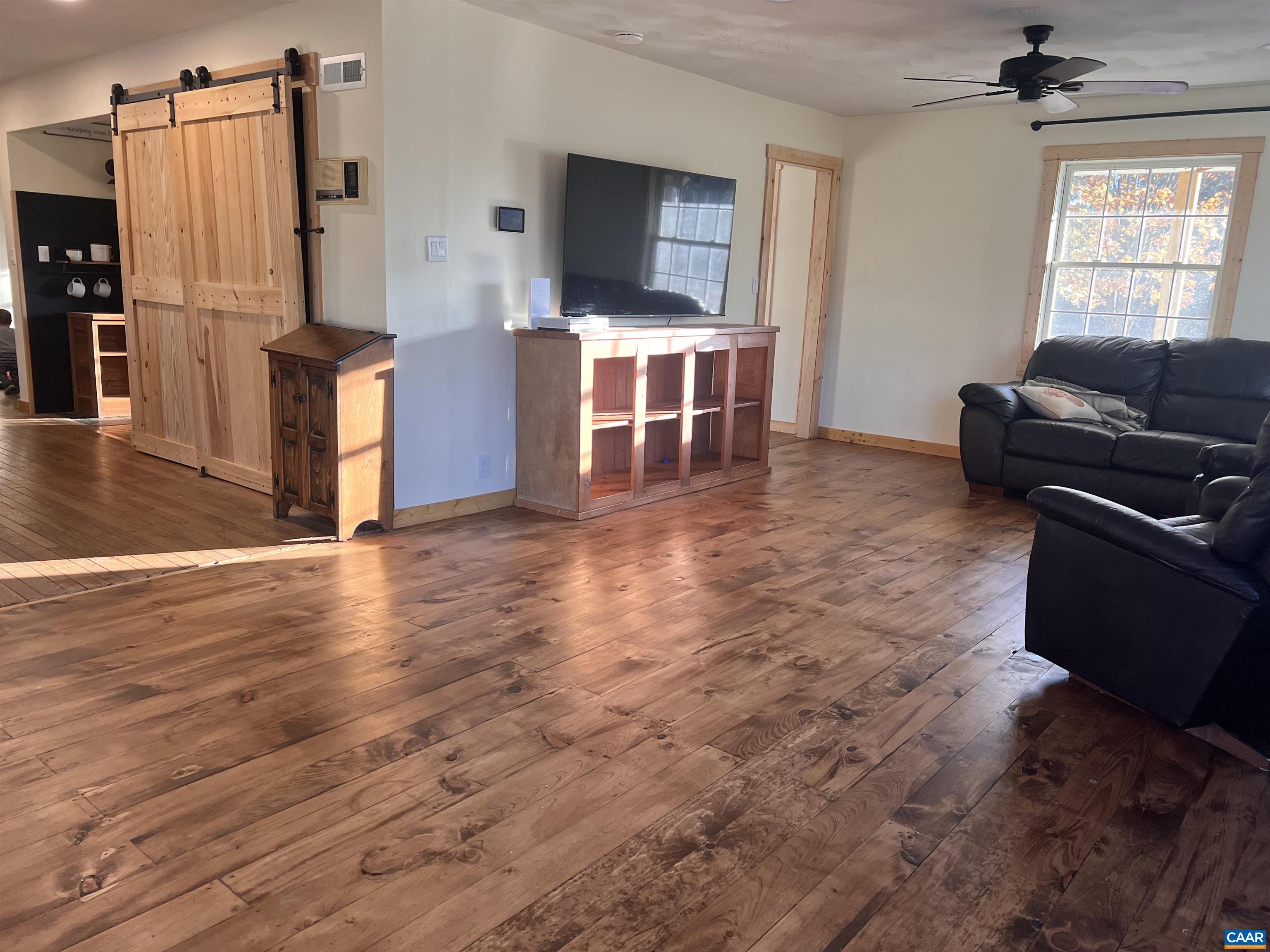 8876 East Timber Ridge Road Mount Crawford, VA 22841 - Photo 32 of 75 a living room with furniture and a flat screen tv