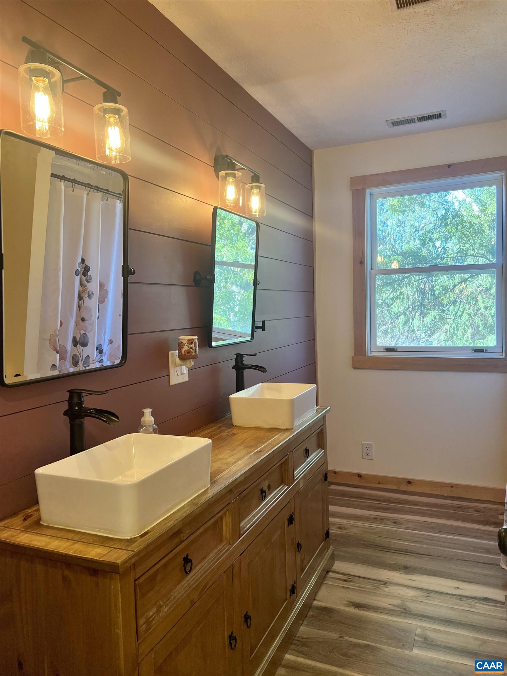 8876 East Timber Ridge Road Mount Crawford, VA 22841 - Photo 48 of 75 a bathroom with a sink and a mirror