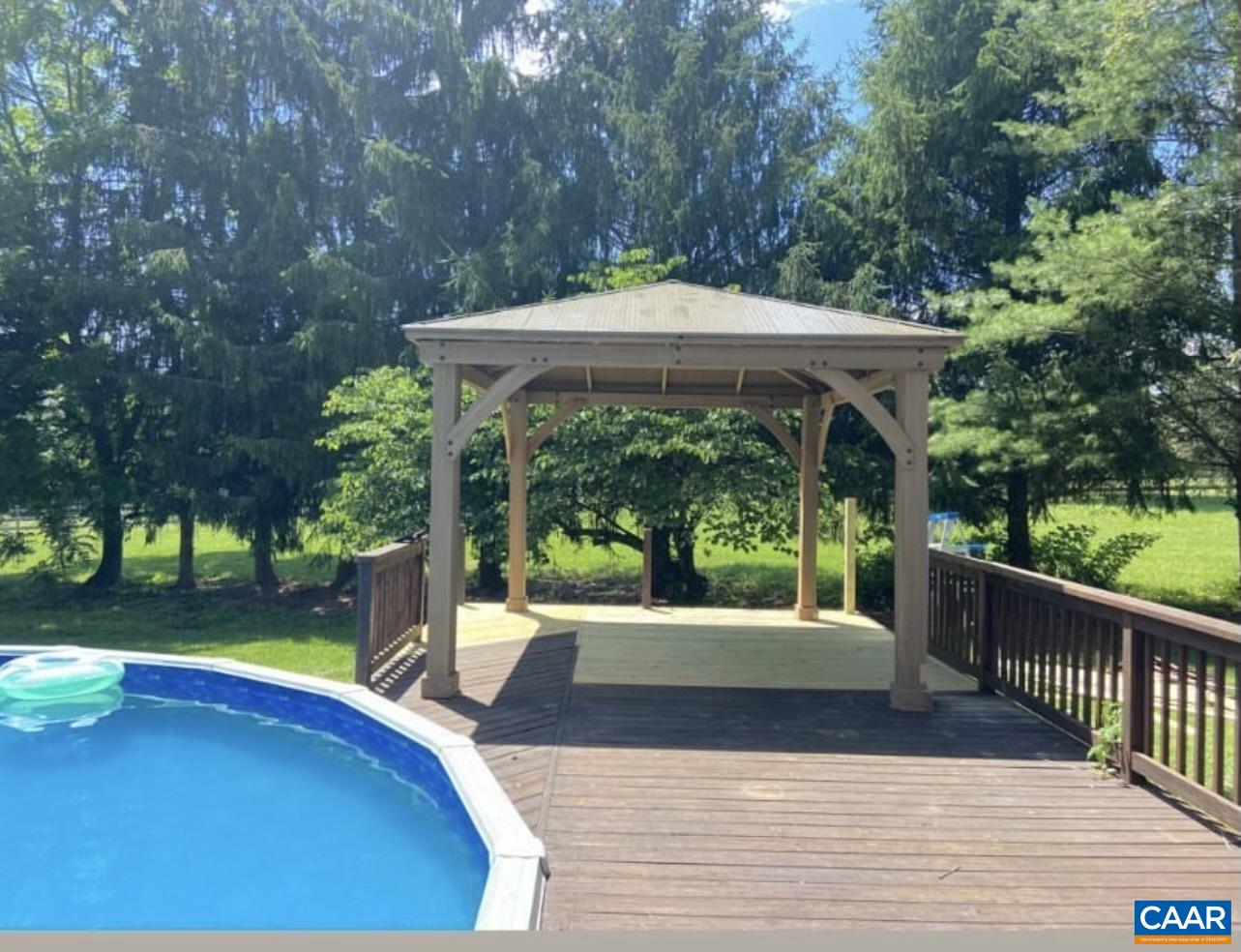 8876 East Timber Ridge Road Mount Crawford, VA 22841 - Photo 8 of 75 a view of a patio with wooden floor and roof