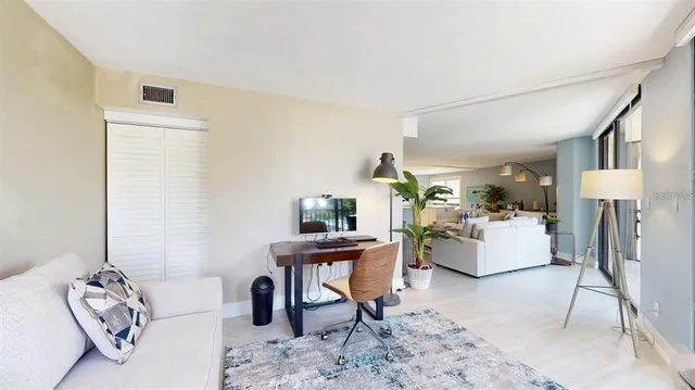 a living room with furniture and a table