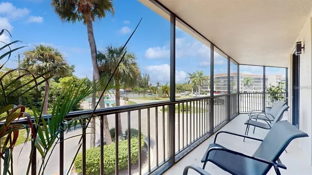 a view of a balcony with furniture