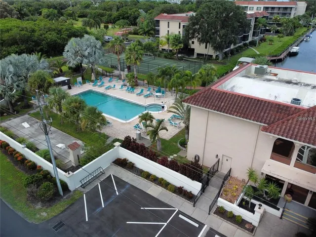 an aerial view of a house with garden space and street view
