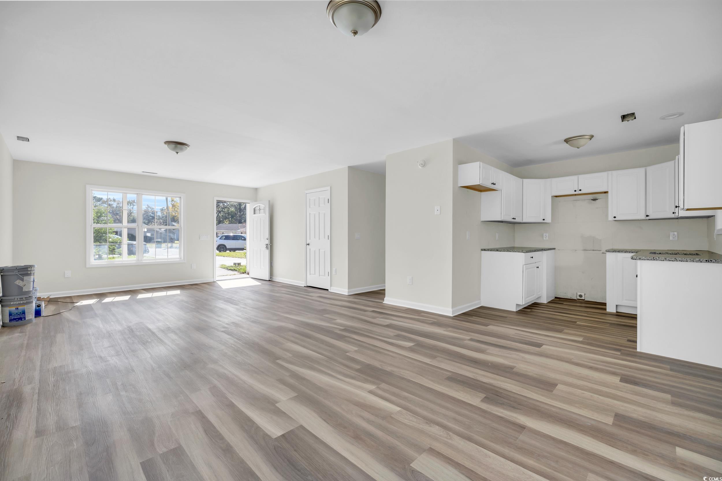 1960 Hampton Street Georgetown, SC 29440 - Photo 6 of 22 Unfurnished living room with light hardwood / wood