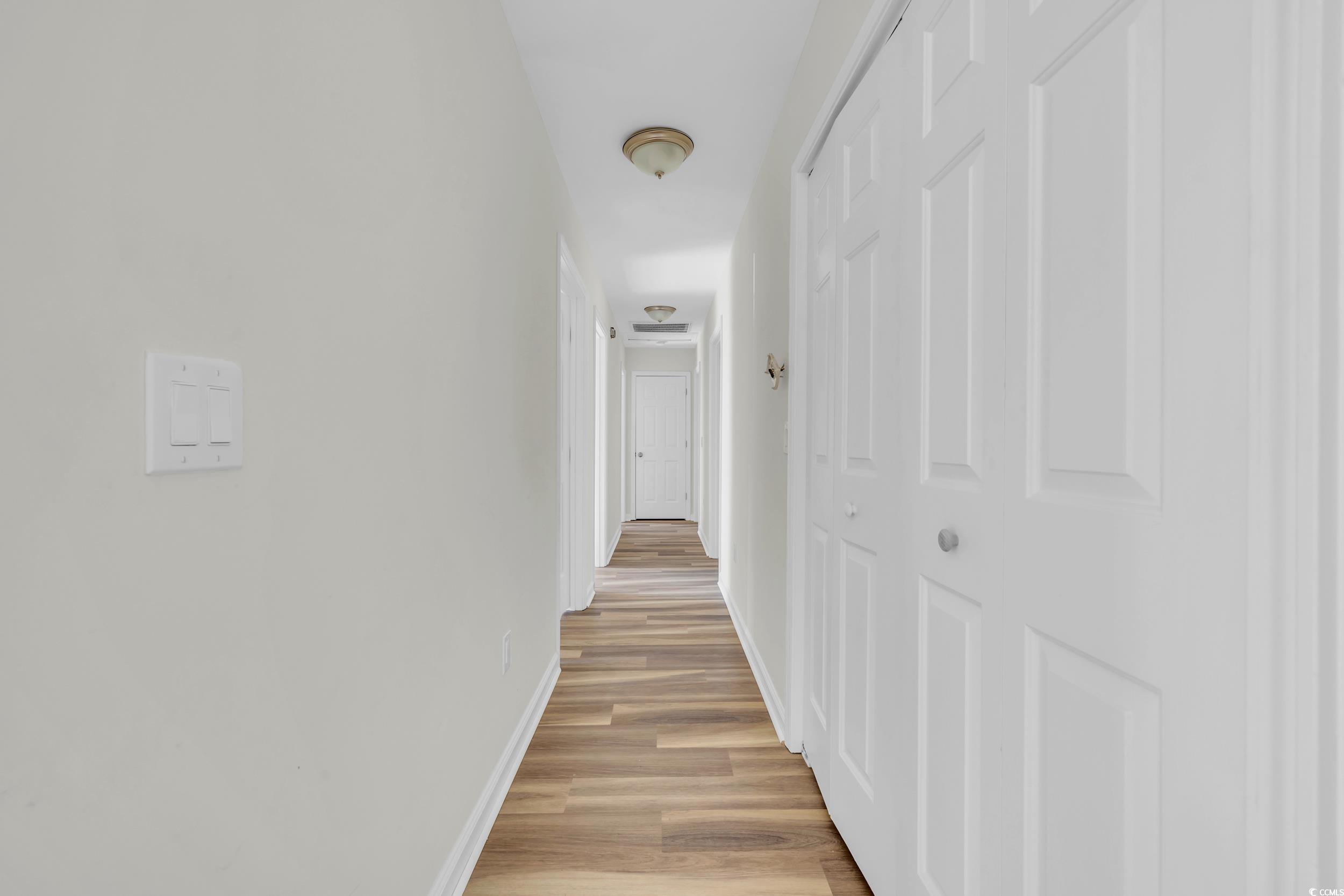 1960 Hampton Street Georgetown, SC 29440 - Photo 7 of 22 Corridor featuring light hardwood / wood-style flo