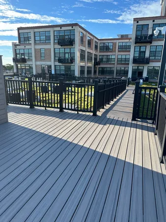 a view of a balcony with wooden floor