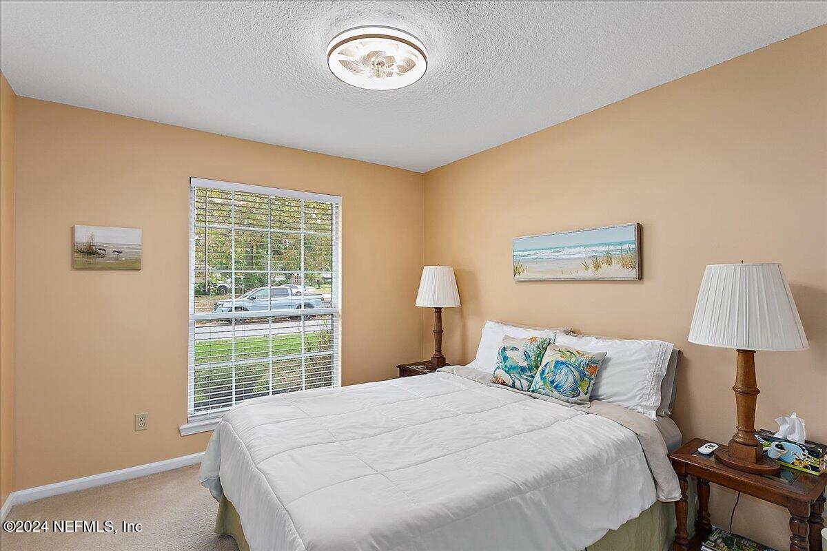 12417 Nesting Eagles Way Jacksonville, FL 32225 - Photo 13 of 23 a bedroom with a bed and a window