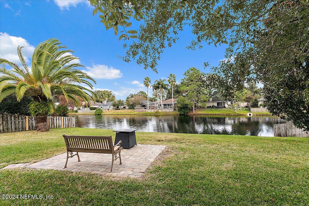 12417 Nesting Eagles Way Jacksonville, FL 32225 - Photo 19 of 23 a swimming pool with outdoor seating and yard