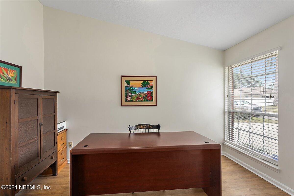 12417 Nesting Eagles Way Jacksonville, FL 32225 - Photo 5 of 23 a room with a table and a window