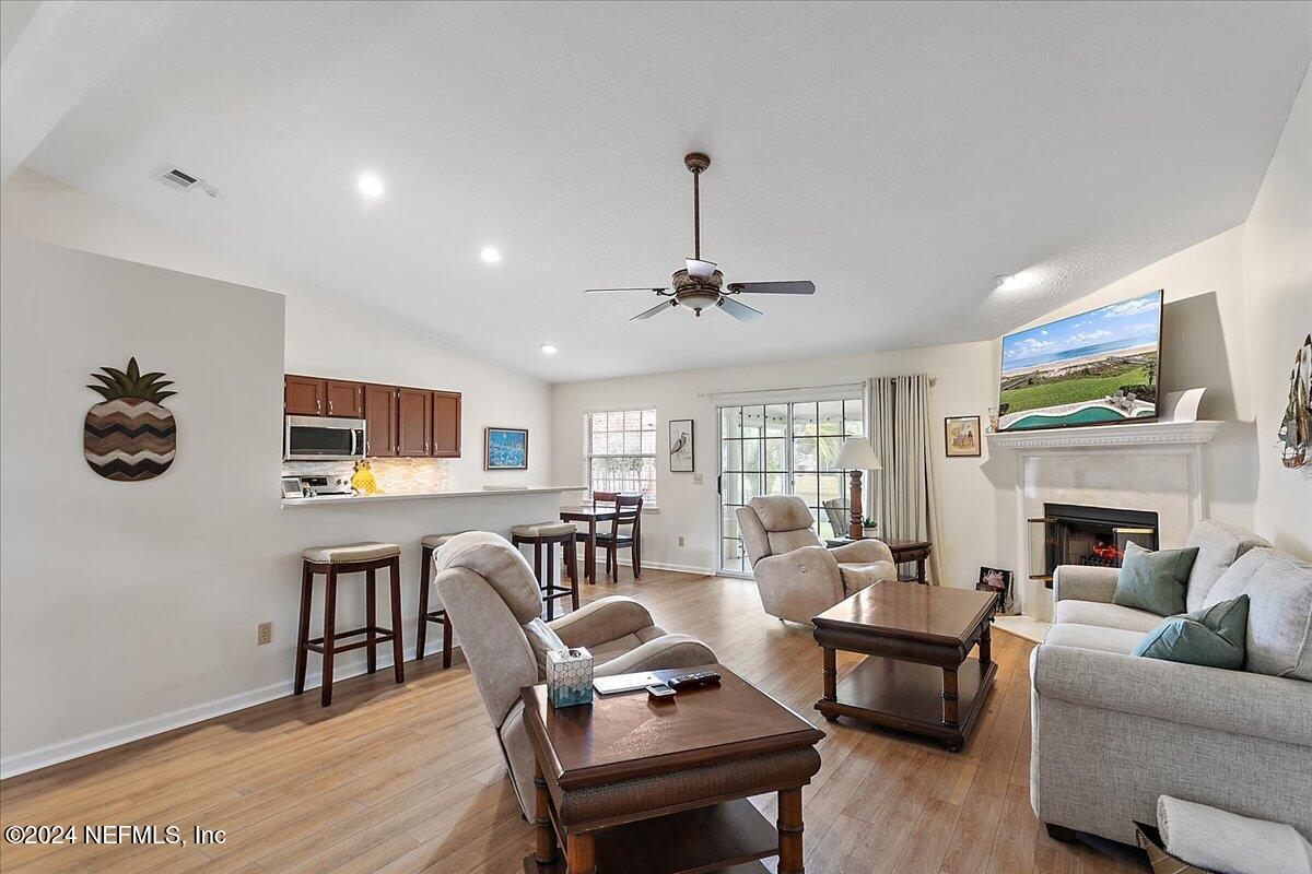 12417 Nesting Eagles Way Jacksonville, FL 32225 - Photo 7 of 23 a living room with furniture and a fireplace