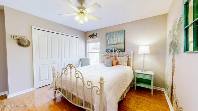 a view of walk in closet with clothes