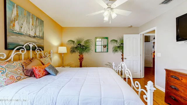 a bathroom with a toilet and a shower curtain