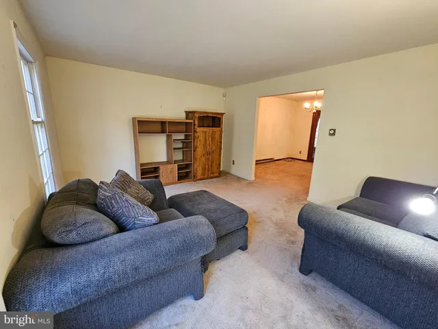a living room with furniture and a couch
