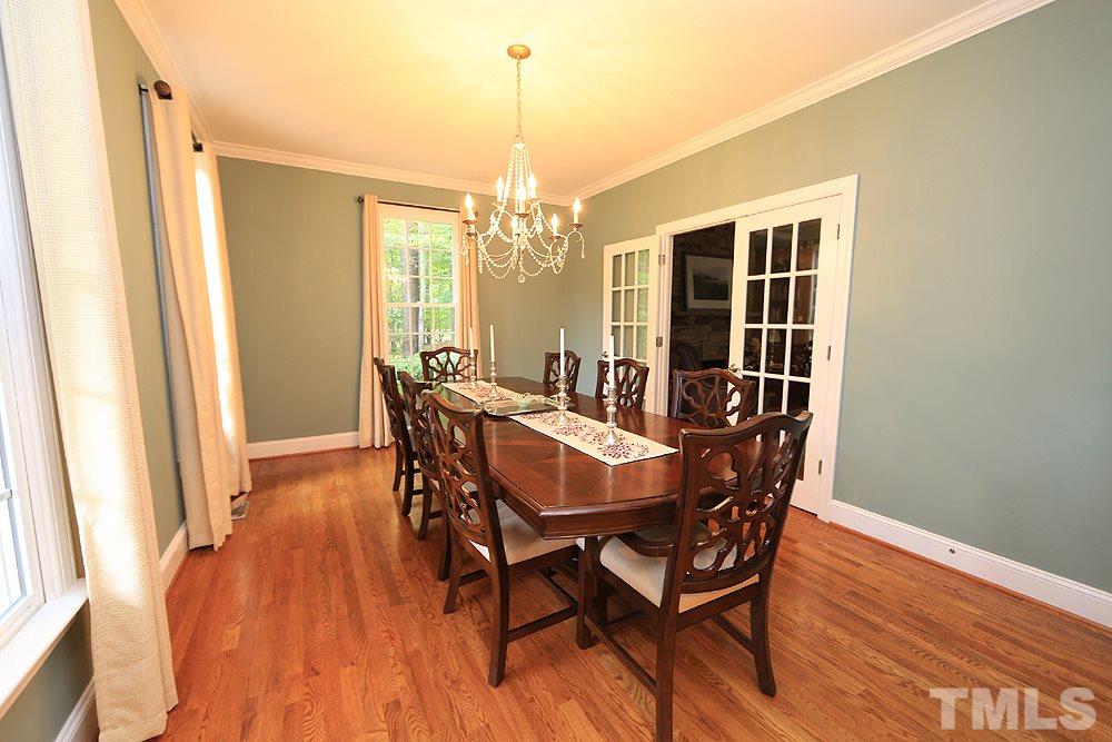 5921 Wild Orchid Trail Raleigh, NC 27613 - Photo 7 of 30 This room is currently used as a dining room but could easily be an office or a den.