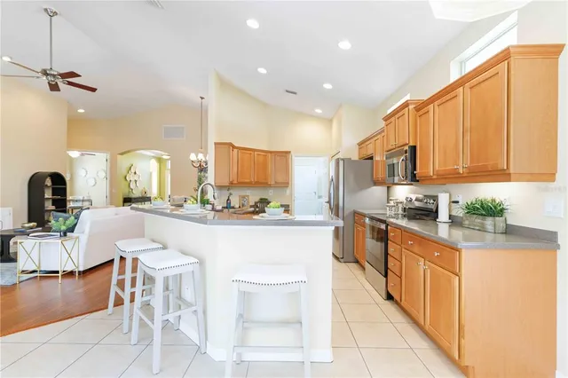 a kitchen with counter top space and appliances