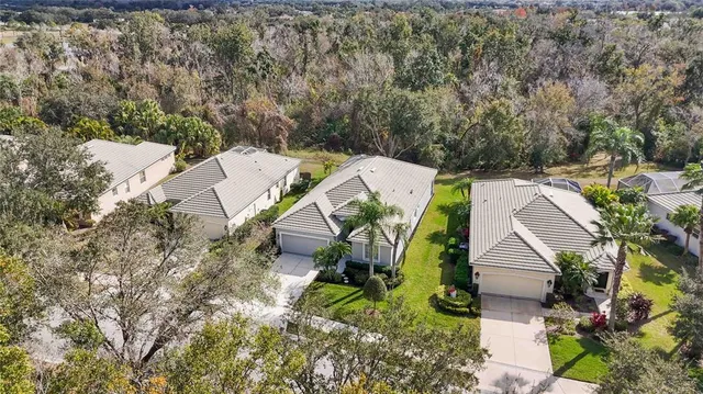 an aerial view of a house with garden and plants