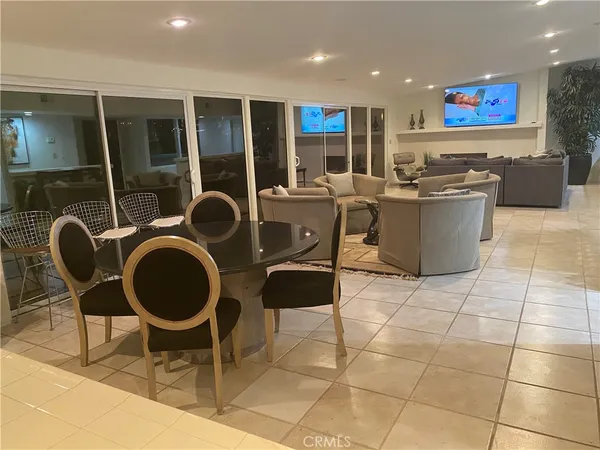 an open kitchen with dining table and chairs