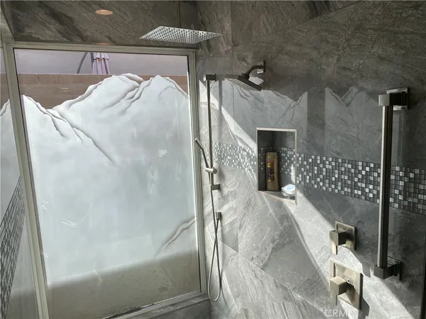 a bedroom with bed and balcony