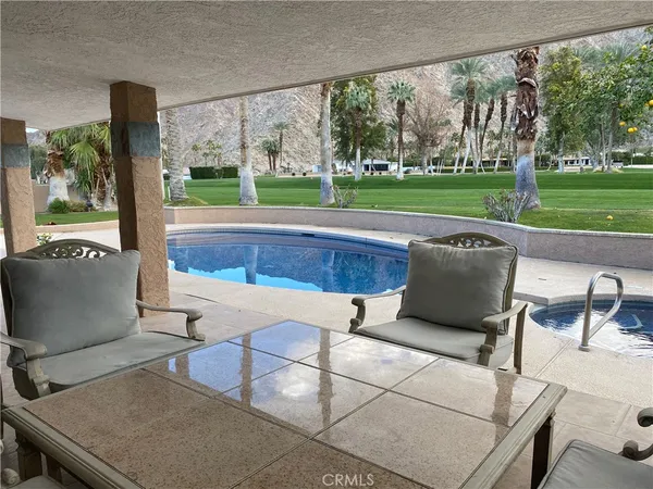 a view of a swimming pool with a patio