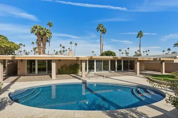 a view of swimming pool with a patio