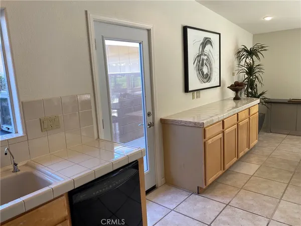 a room with cabinets and wooden floor