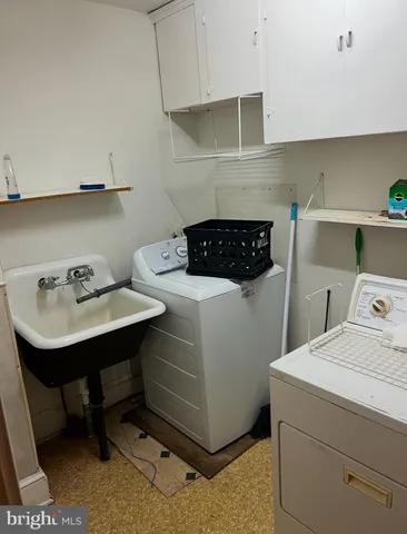 a view of a backyard with large trees