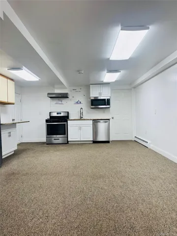 a view of kitchen and microwave
