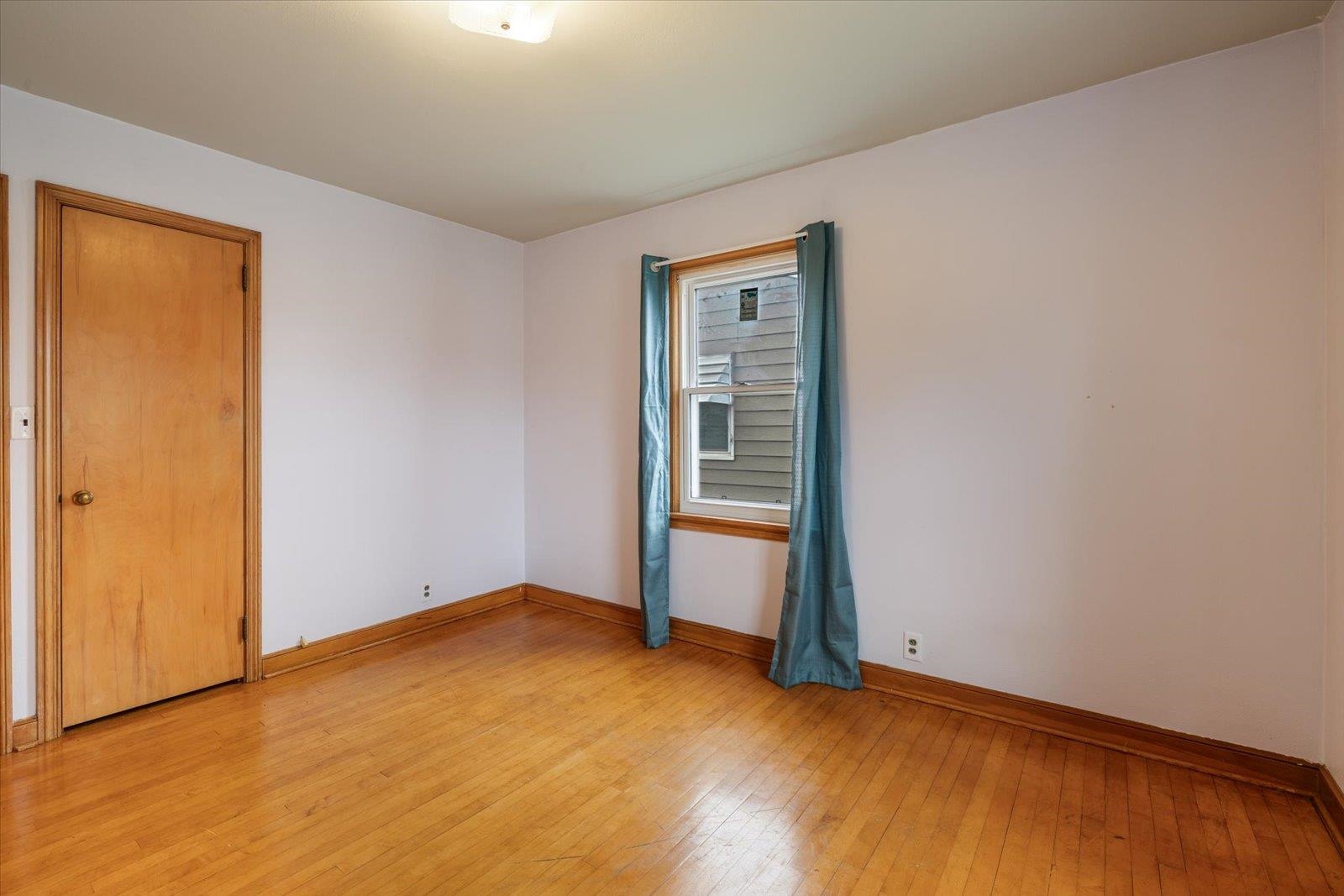 813 6th Street South Virginia, MN 55792 - Photo 25 of 44 Empty room with light wood finished floors and baseboards