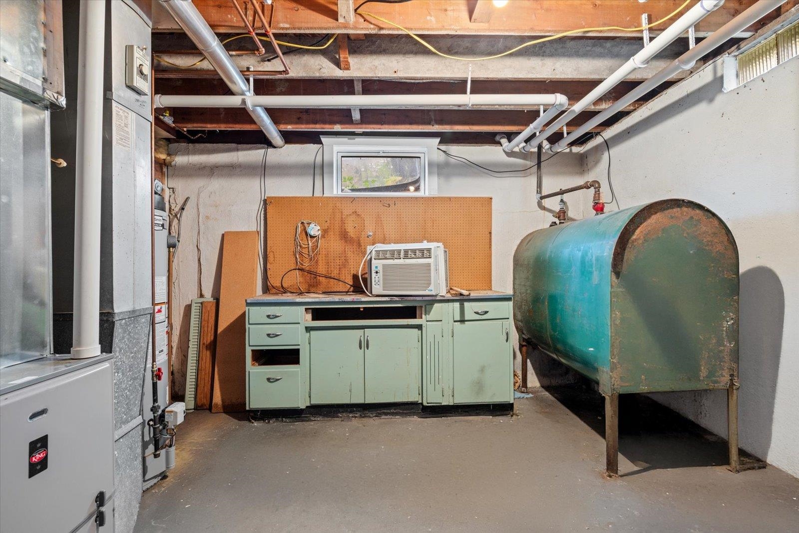 813 6th Street South Virginia, MN 55792 - Photo 35 of 44 Below grade area featuring oil tank and heating unit