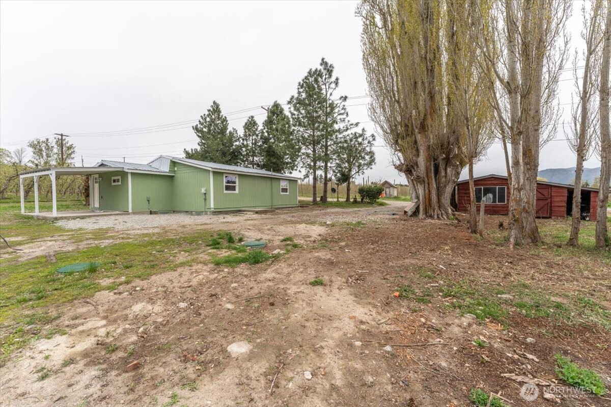 293 Barkley Road Manson, WA 98831 - Photo 32 of 40 a view of a backyard with large trees