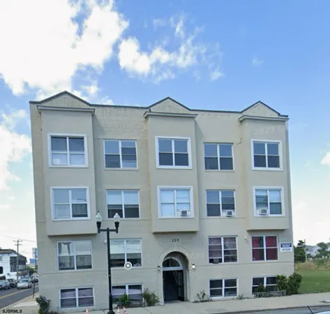 a front view of a building with lot of windows