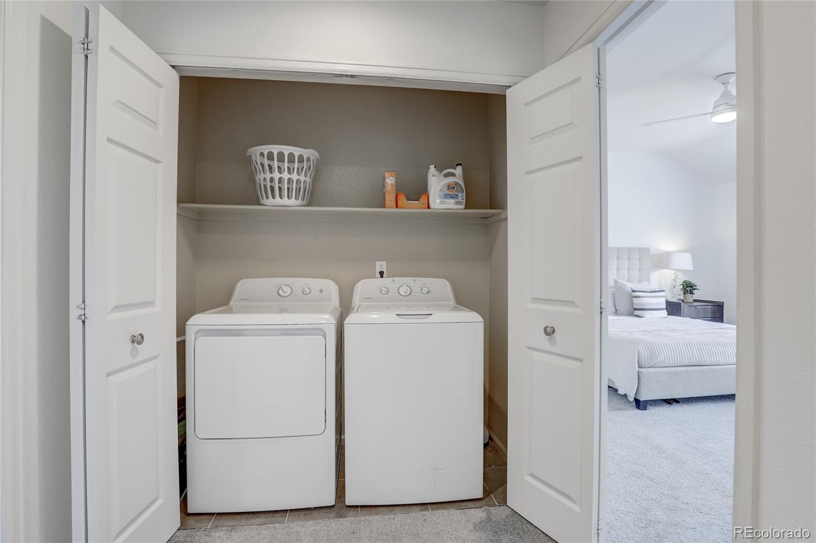 6120 Trailhead Road Highlands Ranch, CO 80130 - Photo 19 of 29 a utility room with dryer and washer