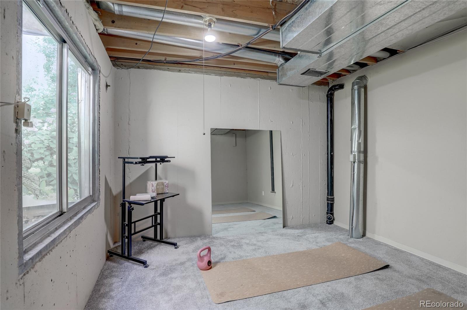 6120 Trailhead Road Highlands Ranch, CO 80130 - Photo 20 of 29 a view of a hallway with wooden walls and windows