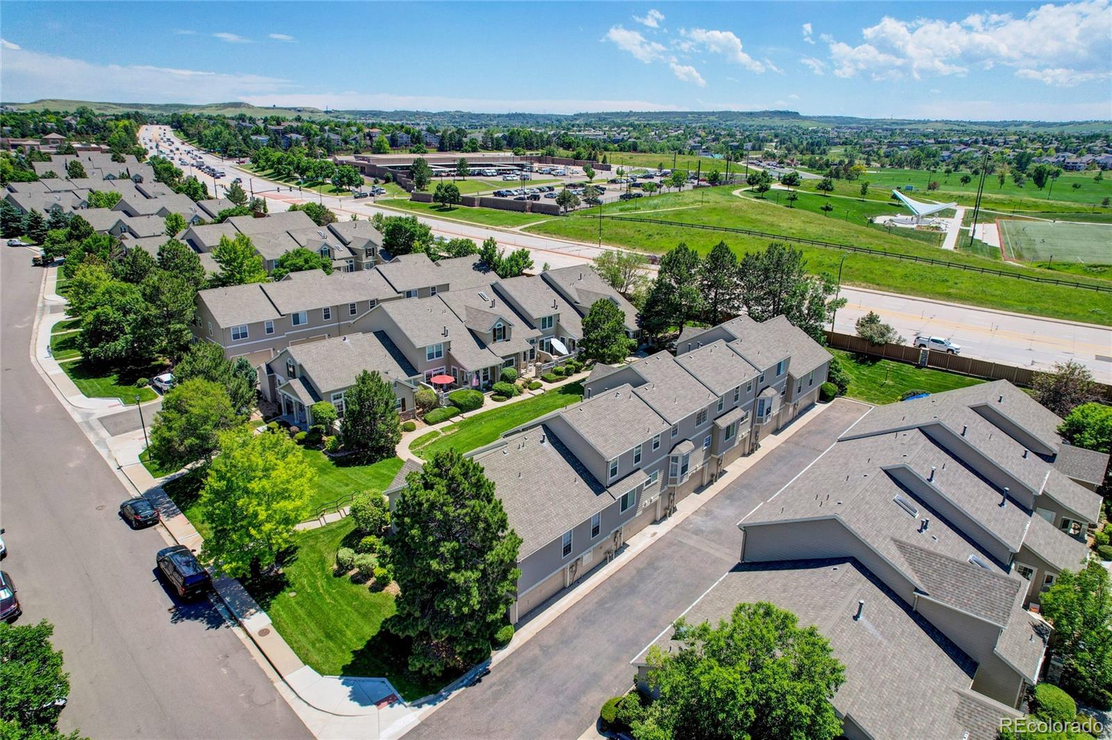6120 Trailhead Road Highlands Ranch, CO 80130 - Photo 25 of 29 an aerial view of a house with a garden and lake view