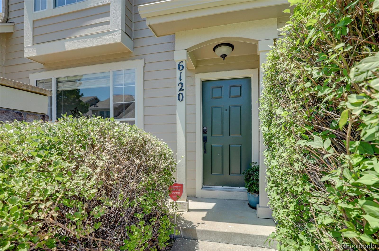 6120 Trailhead Road Highlands Ranch, CO 80130 - Photo 5 of 29 a front view of a house with a yard