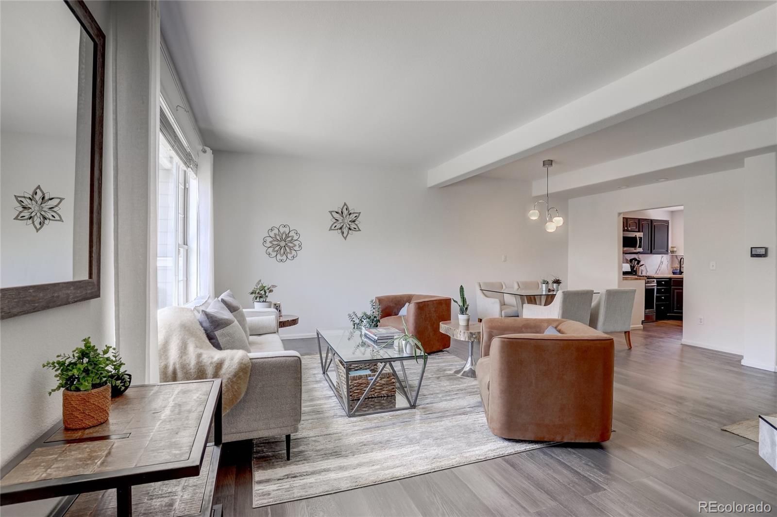 6120 Trailhead Road Highlands Ranch, CO 80130 - Photo 6 of 29 a living room with furniture and wooden floor