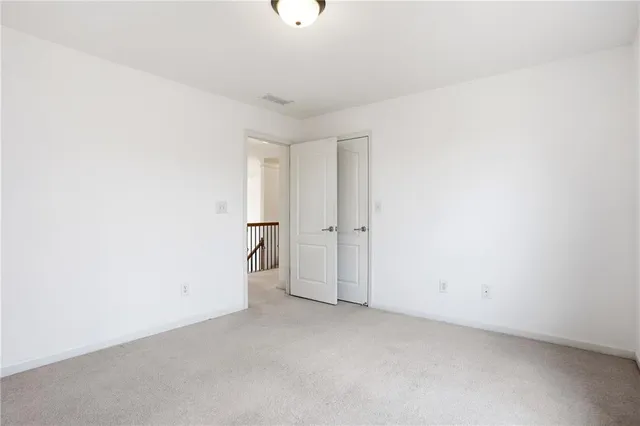 a living room with furniture and a ceiling fan