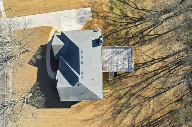 an aerial view of a house with outdoor space